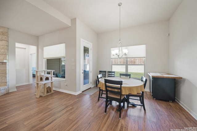 14471 Costa Leon, San Antonio, TX 78245 - dining space with dark wood finished floors, a chandelier, and baseboards