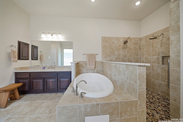 bathroom featuring vanity, tile patterned floors, and separate shower and tub