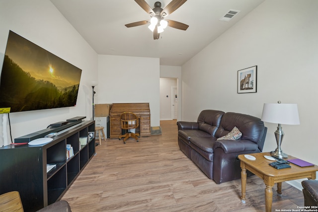 living room featuring ceiling fan and light wood-type flooring