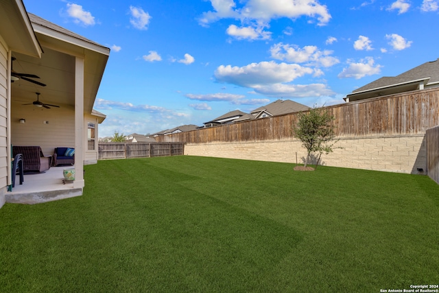 view of yard featuring a patio, an outdoor hangout area, and ceiling fan