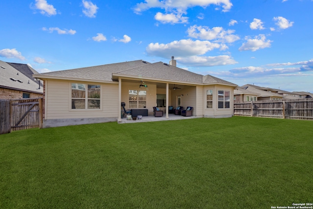 rear view of house with a patio area, a lawn, and ceiling fan