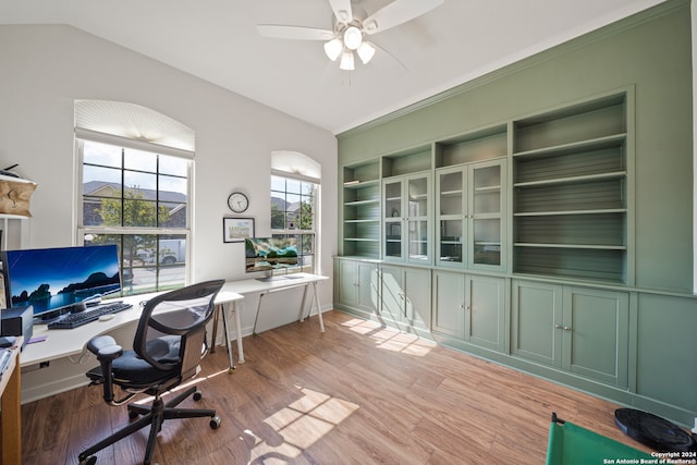 office space with ceiling fan, vaulted ceiling, and light wood-type flooring