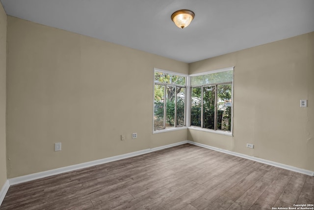 empty room featuring hardwood / wood-style flooring