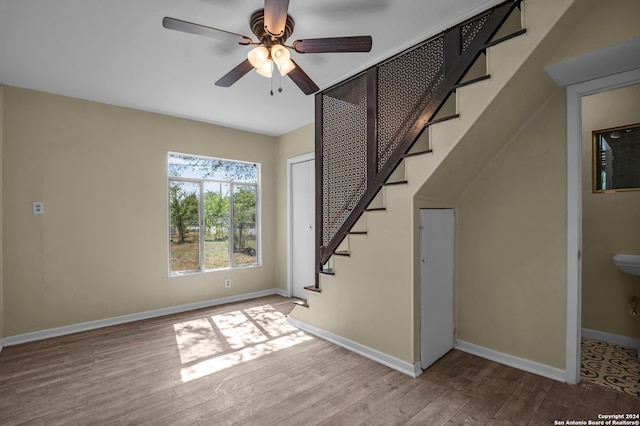 interior space featuring light hardwood / wood-style floors and ceiling fan