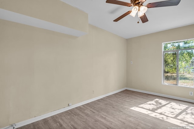 spare room featuring ceiling fan and light wood-type flooring