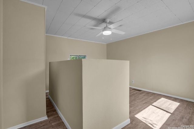 spare room featuring ceiling fan, ornamental molding, and hardwood / wood-style floors