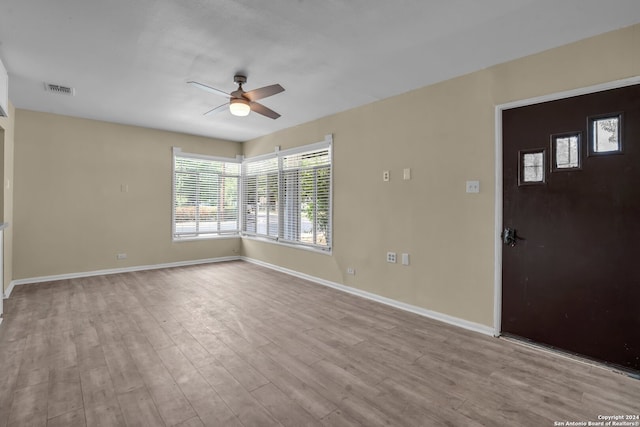 interior space with ceiling fan and light hardwood / wood-style flooring