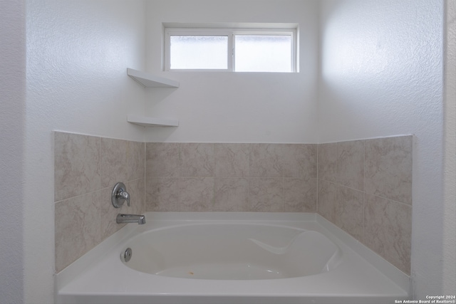 bathroom with a tub