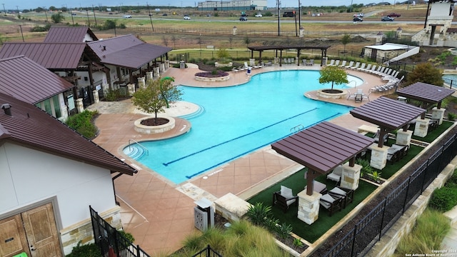 view of swimming pool with a patio area