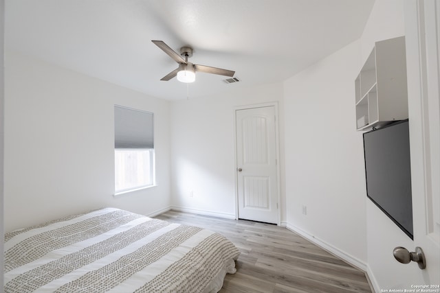 unfurnished bedroom featuring light hardwood / wood-style flooring and ceiling fan