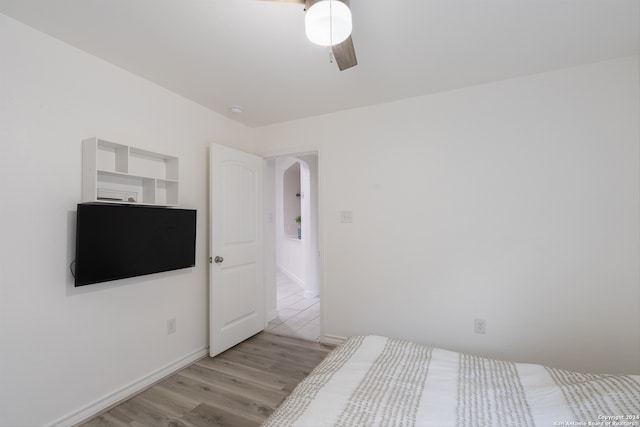 bedroom featuring light hardwood / wood-style floors and ceiling fan