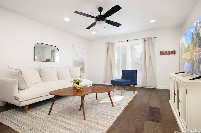 living room featuring hardwood / wood-style flooring and ceiling fan