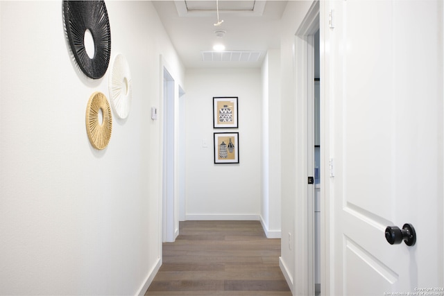 hall with hardwood / wood-style floors