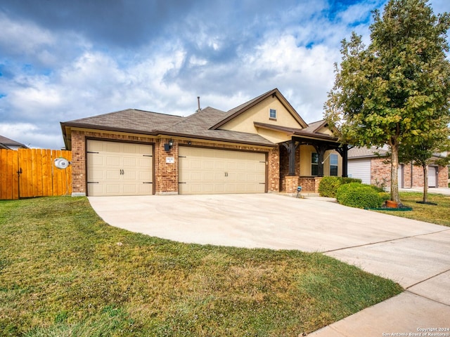 view of front facade with a garage and a front lawn