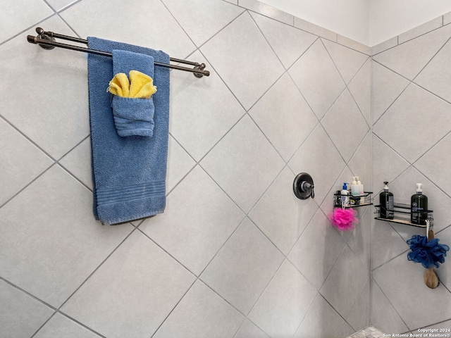 bathroom with tile walls and walk in shower