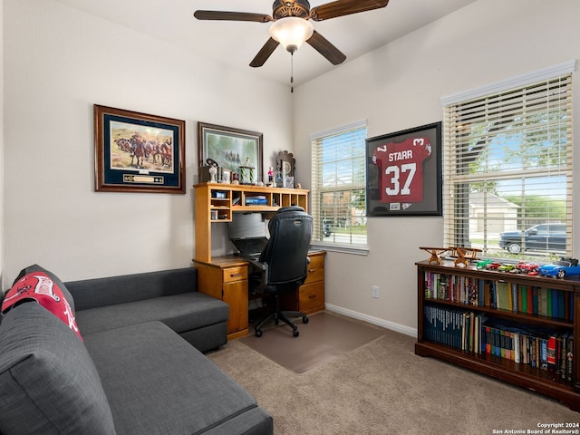 carpeted office featuring ceiling fan