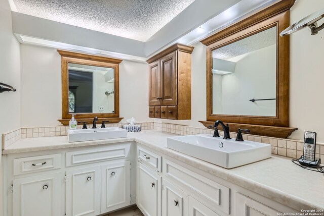 bathroom with vanity and a textured ceiling