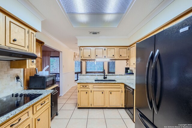 kitchen featuring black appliances, sink, kitchen peninsula, ornamental molding, and light tile patterned floors