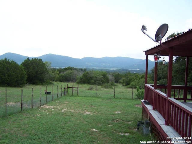 view of yard featuring a mountain view and a rural view