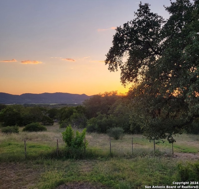 mountain view featuring a rural view