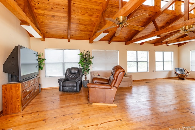 living room with vaulted ceiling with beams, ceiling fan, wood ceiling, and light hardwood / wood-style flooring