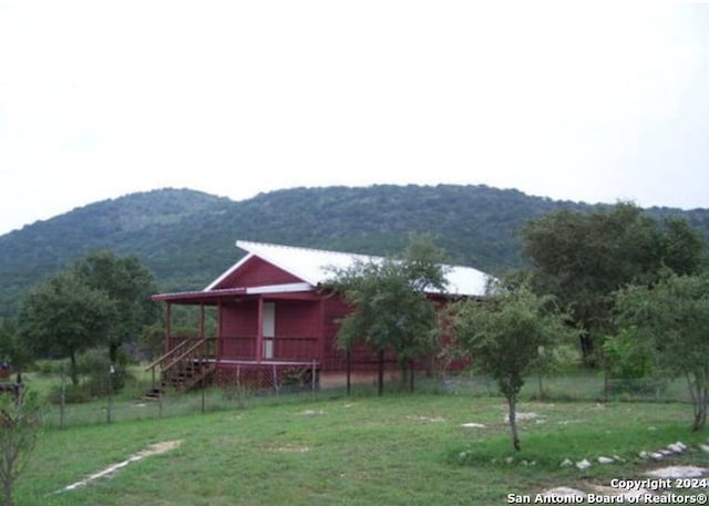 exterior space with a mountain view and a rural view