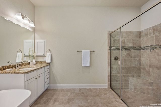28964 Windlesham Way, San Antonio, TX 78260 - bathroom with vanity, baseboards, a freestanding tub, and a stall shower