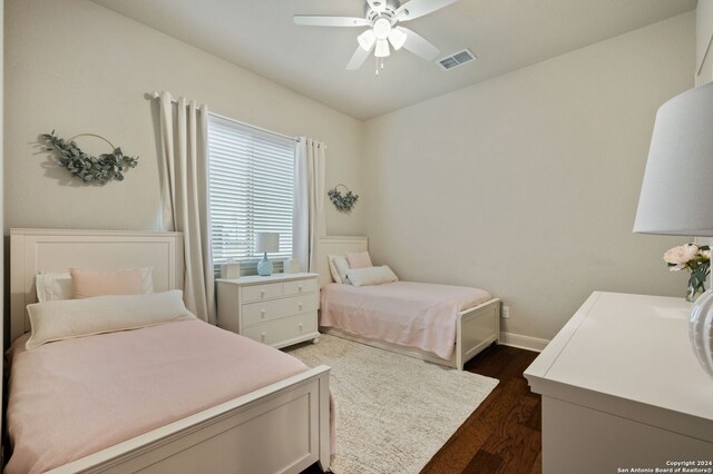 28964 Windlesham Way, San Antonio, TX 78260 - bedroom featuring baseboards, a ceiling fan, dark wood finished floors, and visible vents