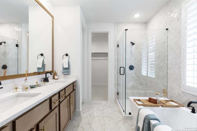 bathroom featuring vanity and shower with separate bathtub