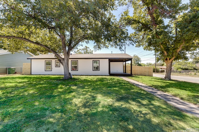 ranch-style home with a front yard