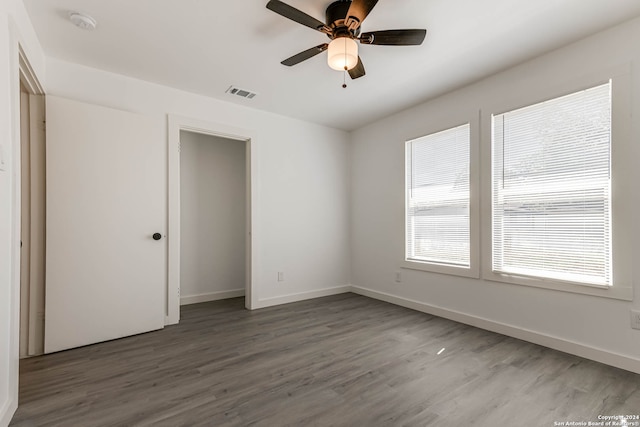 empty room featuring hardwood / wood-style floors and ceiling fan