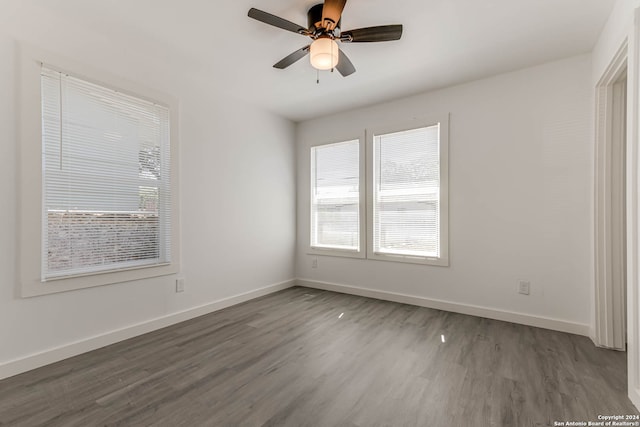 unfurnished room with hardwood / wood-style floors and ceiling fan