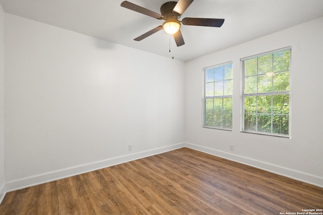 empty room featuring hardwood / wood-style floors and ceiling fan