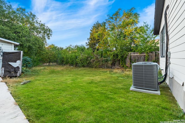 view of yard with central AC