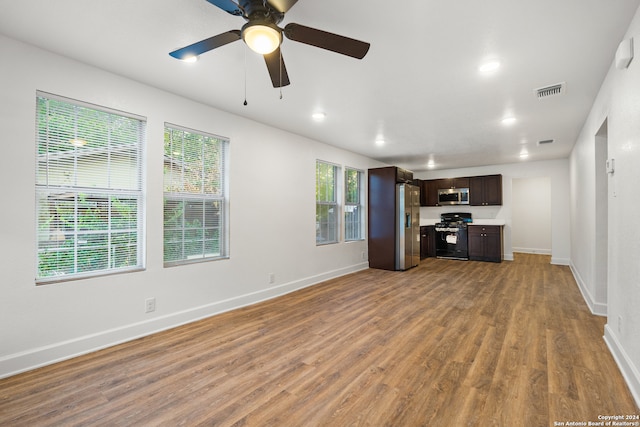 unfurnished living room featuring light hardwood / wood-style flooring and ceiling fan