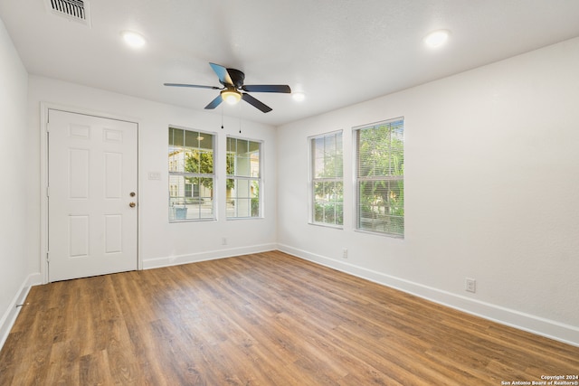 spare room featuring ceiling fan and hardwood / wood-style flooring