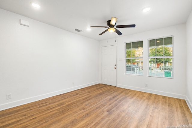 unfurnished room featuring ceiling fan and wood-type flooring