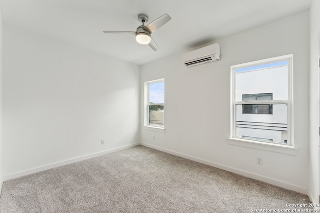 carpeted spare room featuring ceiling fan and an AC wall unit