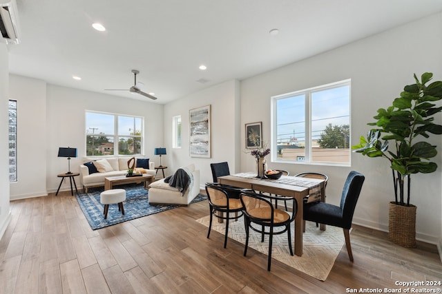 dining space featuring ceiling fan and hardwood / wood-style flooring