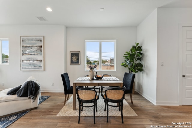 dining space featuring light wood-type flooring