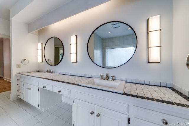 bathroom with vanity and tile patterned flooring