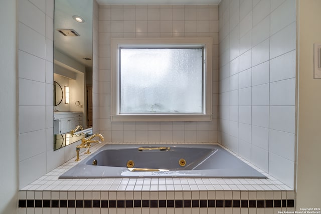 bathroom with tiled bath