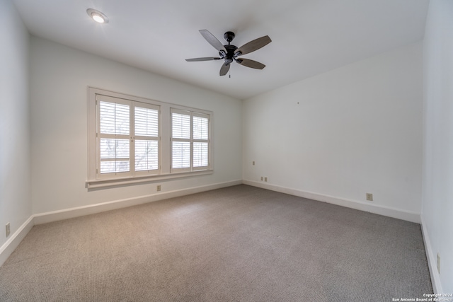 unfurnished room featuring carpet floors and ceiling fan