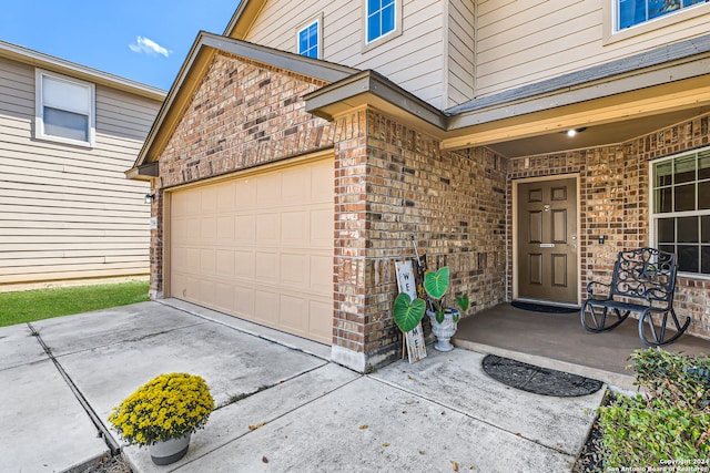 entrance to property featuring a garage