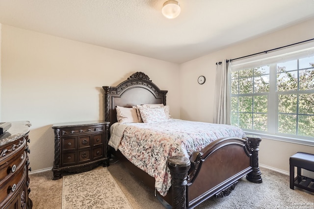 bedroom featuring light carpet