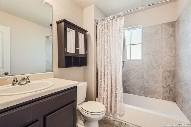 full bathroom featuring vanity, toilet, and shower / bathtub combination with curtain