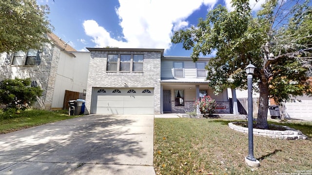 view of front of property featuring a front yard and a garage