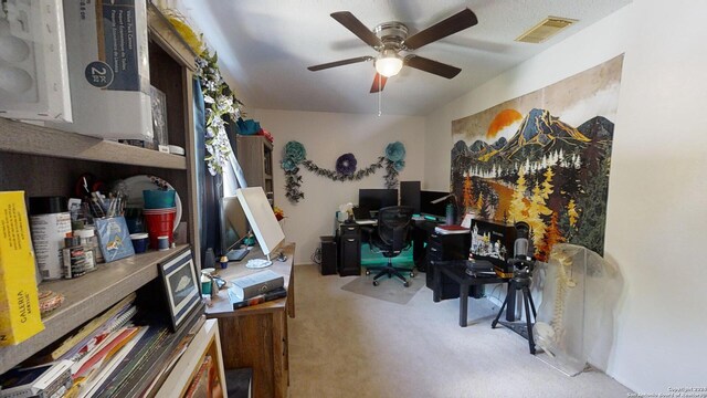 home office featuring ceiling fan and light colored carpet