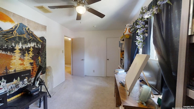 interior space with ceiling fan and light carpet