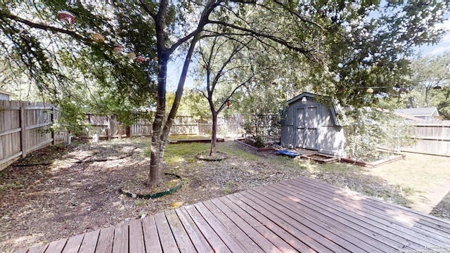 wooden terrace featuring a storage unit